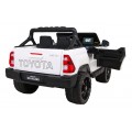 Toyota Hilux na akumulator dla dzieci Biały Pickup + Napęd 4x4 + Pilot + 2 bagażniki